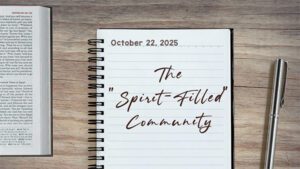a notebook on a table next to a pen. Journal entry dated October 22, 2025. Entry titled "A Spirit-Filled community"