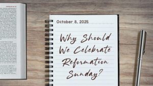 a notebook on a table next to a pen. Journal entry dated October 8, 2025. Entry titled "Why should we Celebrate reformation Sunday"