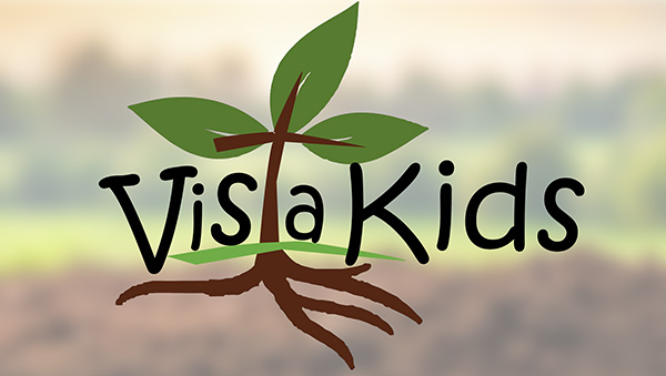 the VGBC children's ministry logo of leaves and a root in front of a blurred photo of soil