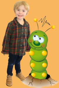 caterpillar a Vista Kids Preschool child standing next to a green caterpillar